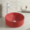 Évier rond en céramique lisse de salle de bains au-dessus de contre- lavabo orange de dessus de Tableau